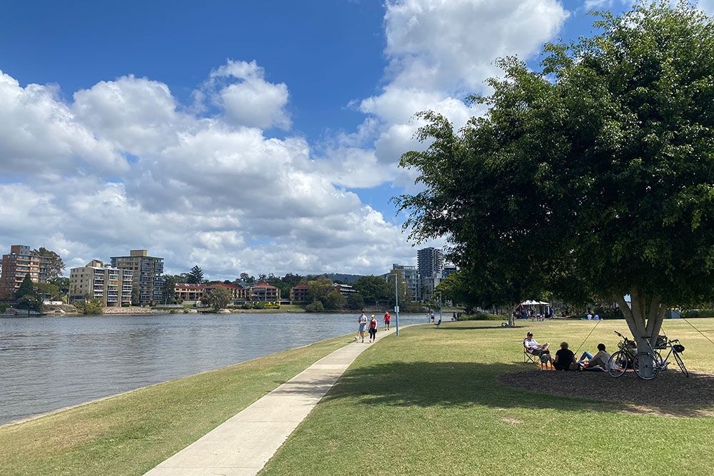 A park by the river in West End.